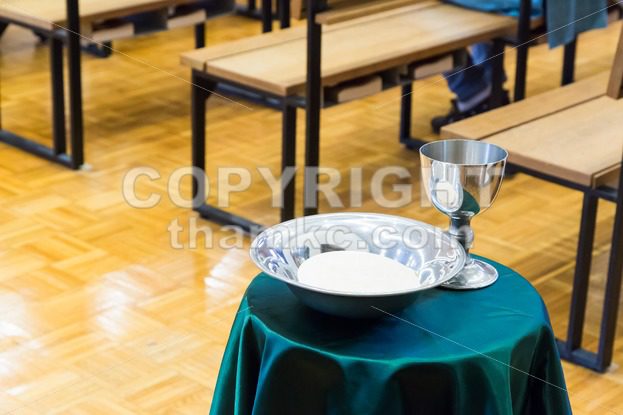 Catholic bread and wine in silver chalice - ThamKC Royalty-Free Photos