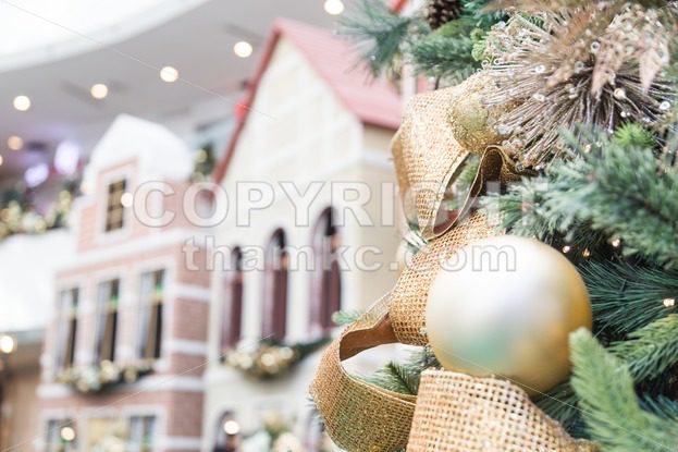 Closeup of Christmas tree with ornaments and home background - ThamKC Royalty-Free Photos