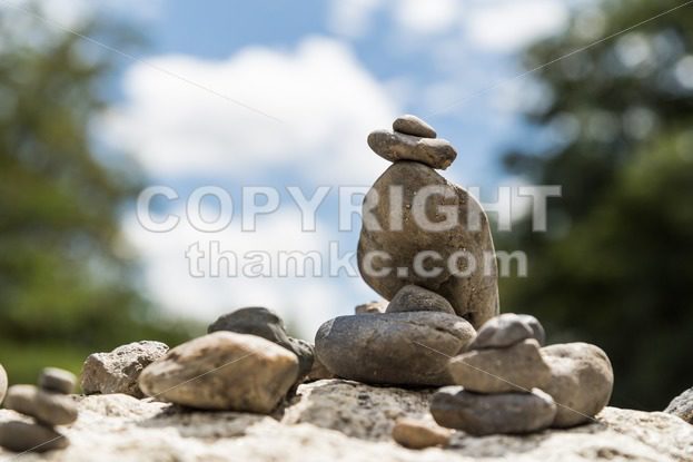 Closeup of Zen rock arrangement with nature background - ThamKC Royalty-Free Photos