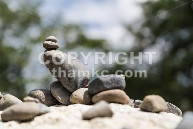 Closeup of Zen rock arrangement with nature background - ThamKC Royalty-Free Photos