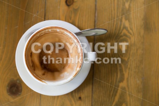 Empty cup and saucer with coffee stain - ThamKC Royalty-Free Photos