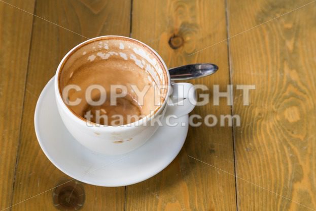 Empty cup and saucer with coffee stain - ThamKC Royalty-Free Photos
