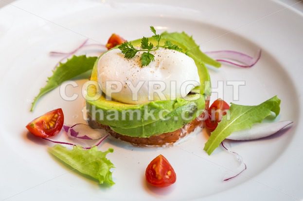 Healthy avocado poached eggs breakfast set - ThamKC Royalty-Free Photos