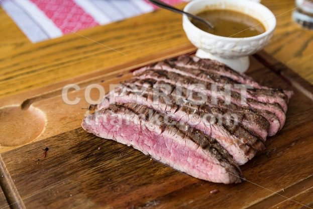 Juicy medium rare beef slice with sauce - ThamKC Royalty-Free Photos