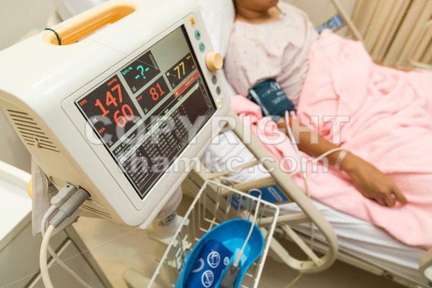 Patient monitoring machine in hospital ward - ThamKC Royalty-Free Photos