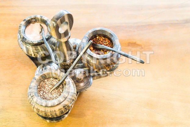 Salt, pepper, chili flakes spices in container - ThamKC Royalty-Free Photos