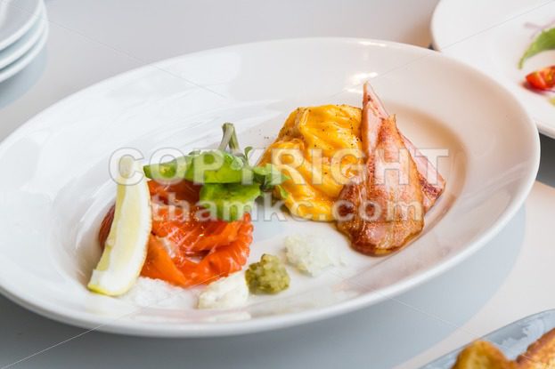Simple healthy breakfast smoked salmon, ham, scrambled eggs - ThamKC Royalty-Free Photos