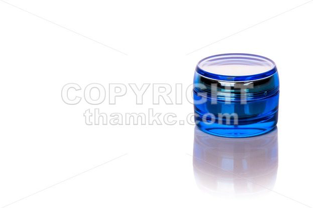 Blue skincare cosmetic jar on white background - ThamKC Royalty-Free Photos
