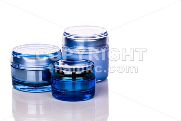 Blue skincare cosmetic jar on white background - ThamKC Royalty-Free Photos