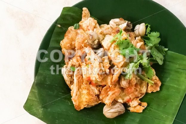 Asian delicious fried oysters with eggs omelette cuisine - ThamKC Royalty-Free Photos
