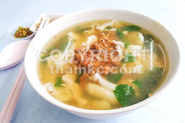 Flat flour noodle soup or Pan Mee, popular Malaysia cuisine - ThamKC Royalty-Free Photos