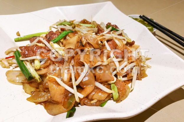 Fried Kuey Teow with beef, popular in Malaysia - ThamKC Royalty-Free Photos