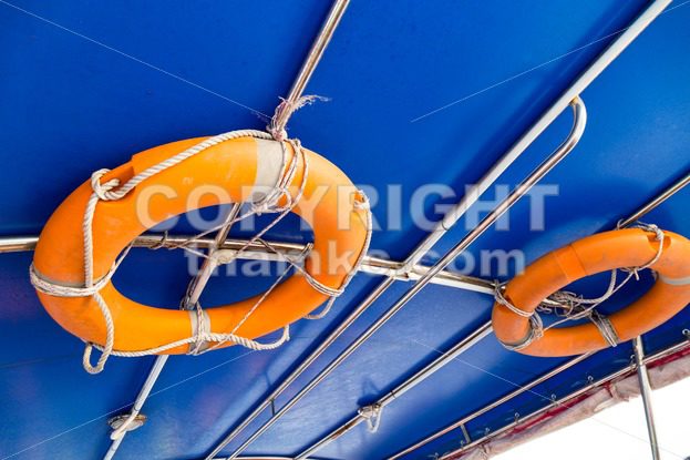 Life buoy attached to the ceiling of boat - ThamKC Royalty-Free Photos