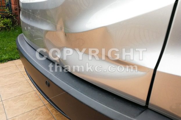 Minor dent at car rear door due to accident - ThamKC Royalty-Free Photos