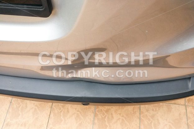 Minor dent at car rear door due to accident - ThamKC Royalty-Free Photos