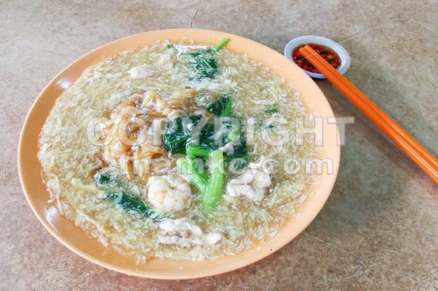 Plate of delicious fried kuey teow noodle Chinese Cantonese style - ThamKC Royalty-Free Photos