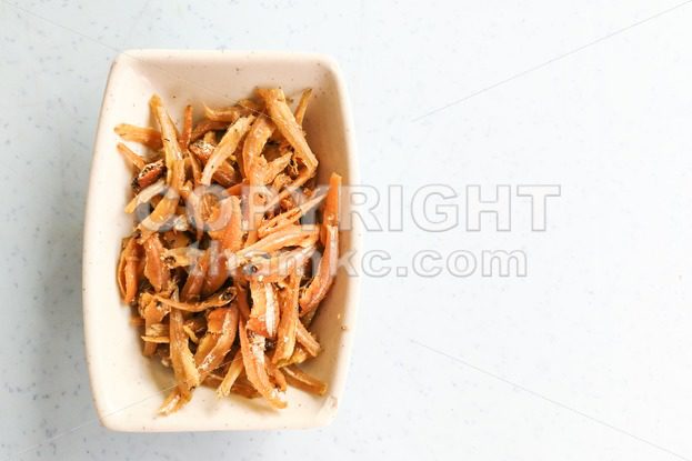 Plate of fried crispy anchovies, Asian recipe - ThamKC Royalty-Free Photos