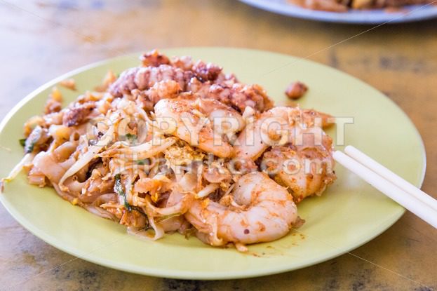 Close-up Penang Char Kuey Teow or fried noodle with prawns - ThamKC Royalty-Free Photos