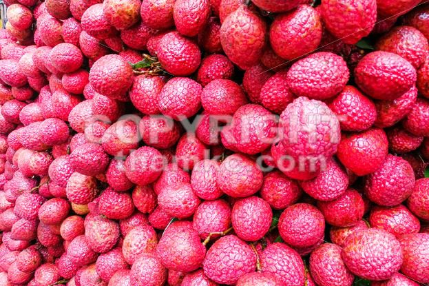 Close-up on heap group of lychee fruits tied together - ThamKC Royalty-Free Photos