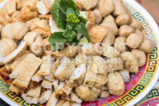Close-up on plate of fish ball fish cakes for steamboat dining - ThamKC Royalty-Free Photos
