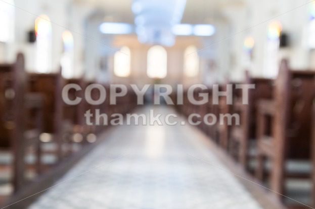 Defocused interior of Catholic church with pews - ThamKC Royalty-Free Photos