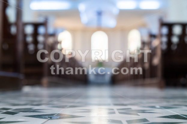 Defocused interior of Catholic church with pews - ThamKC Royalty-Free Photos