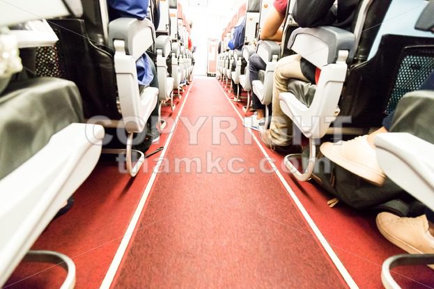 Floor proximity reflector line aids airplane evacuation under dark conditions. - ThamKC Royalty-Free Photos