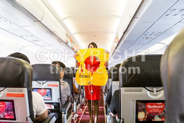 KUALA LUMPUR, Malaysia, June 8, 2017: Airasia hostess demonstrate safety procedures to passengers prior to flight take off - ThamKC Royalty-Free Photos
