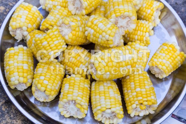Plateful of fresh sweet organic corn steamed ready to eat - ThamKC Royalty-Free Photos