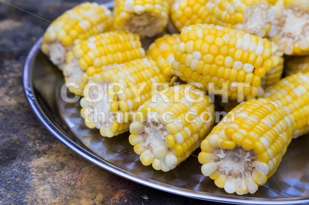 Plateful of fresh sweet organic corn steamed ready to eat - ThamKC Royalty-Free Photos