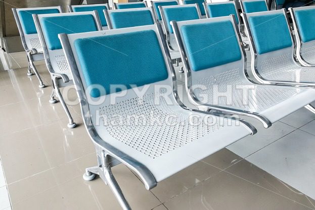 Rows of empty chairs at waiting area - ThamKC Royalty-Free Photos