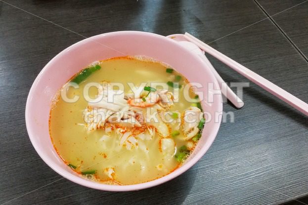 Bowl of popular delicious Malaysia Ipoh sliced chicken noodle soup - ThamKC Royalty-Free Photos