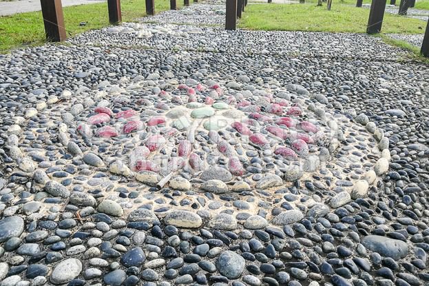 Close-up on pressure points pebble stones at foot reflexology park - ThamKC Royalty-Free Photos