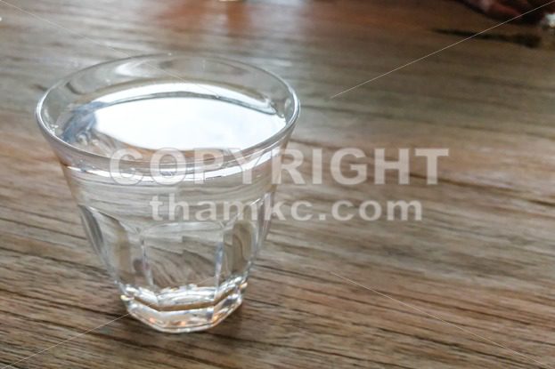 Glass of pure purified mineral drinking water on table - ThamKC Royalty-Free Photos