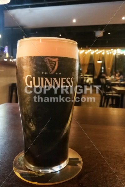 Kuala Lumpur, Malaysia, July 1, 2017:  Guinness is an Irish dry stout that originated in the brewery of Arthur Guinness at St. James’s Gate brewery, Dublin, Ireland. Leading black stout in Malaysia - ThamKC Royalty-Free Photos