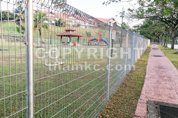 Security fencing at residential home to prevent trespassing - ThamKC Royalty-Free Photos