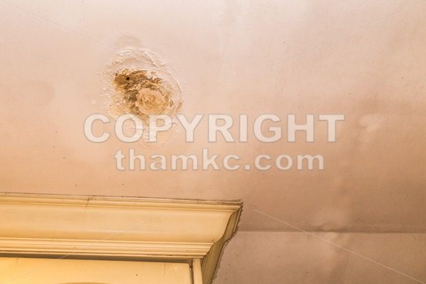 Roof leakages results damage ugly corrosion on plaster ceiling - ThamKC Royalty-Free Photos