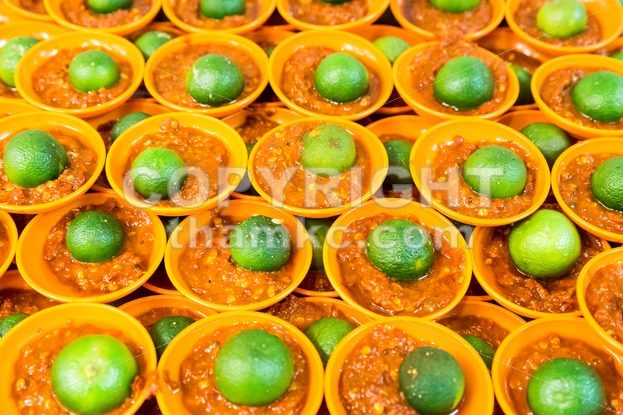 Spicy chili sambal belacan with calamansi lime in mini saucer - ThamKC Royalty-Free Photos