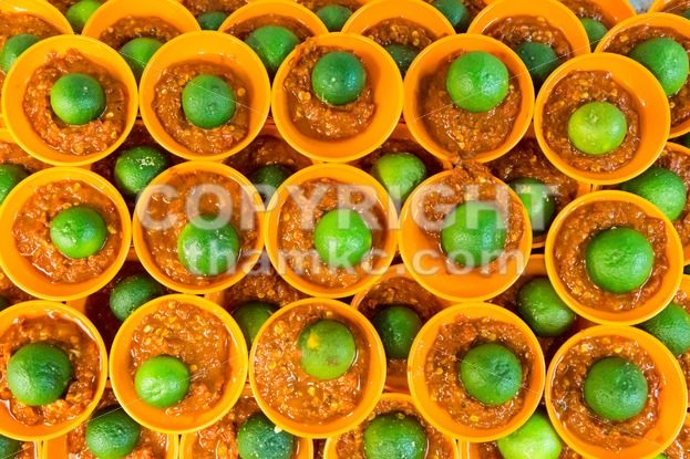 Spicy chili sambal belacan with calamansi lime in mini saucer - ThamKC Royalty-Free Photos