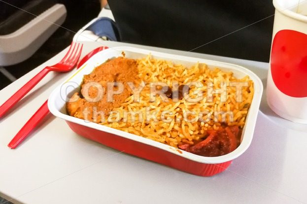 close-up simple in-flight meal rice, meat, coffee in disposable utensils - ThamKC Royalty-Free Photos
