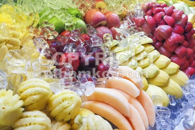 Fresh and refreshing sliced fruits variety neatly arranged - ThamKC Royalty-Free Photos